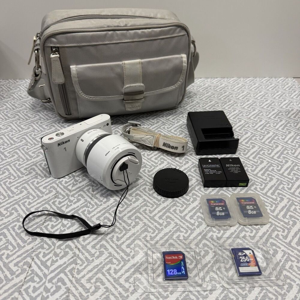 Nikon 1 J1 10.1MP White Camera Bundle - 10-30mm & 30-110mm VR Lenses SD Bag Case